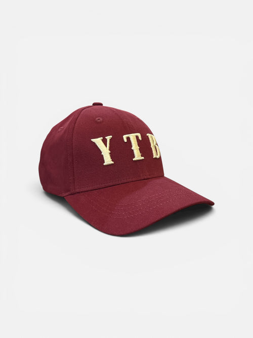 Red Yet To Be (YTB) fashion cap, front angle view