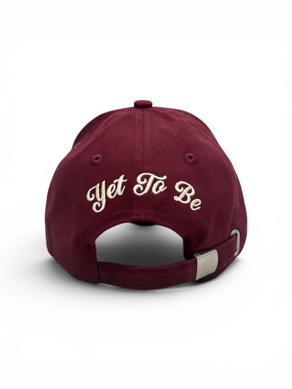 Maroon Yet To Be baseball cap, back view, with Yet To Be script embroidery and adjustable strap