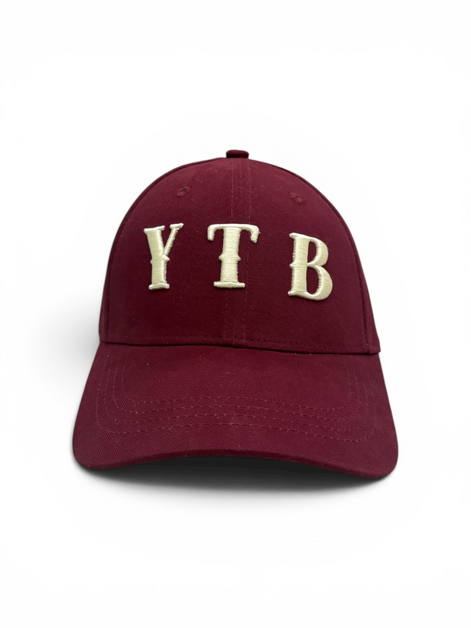 Maroon Yet To Be baseball cap, front view, with cream YTB embroidered logo